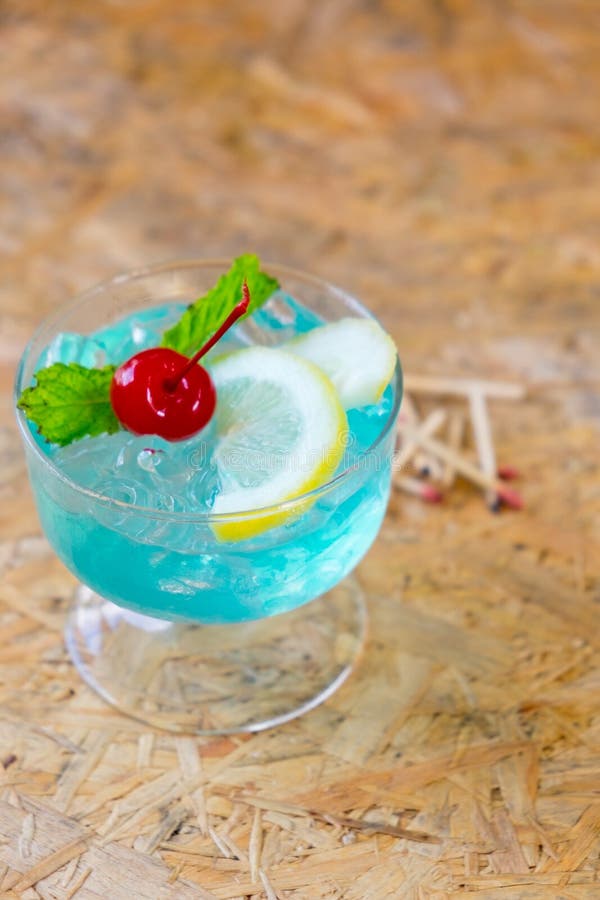 Blue Cocktail with a Slice of Lemon, Mint and Cherry Stock Image