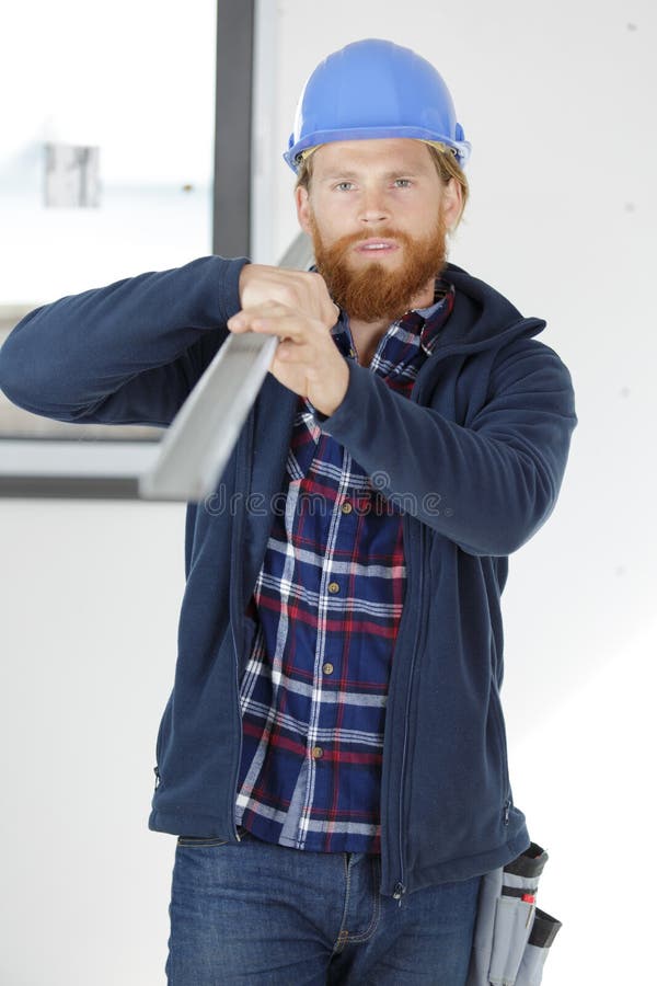 Bluecollar Worker Carrying Heavy Metallic Bar Stock Image Image of
