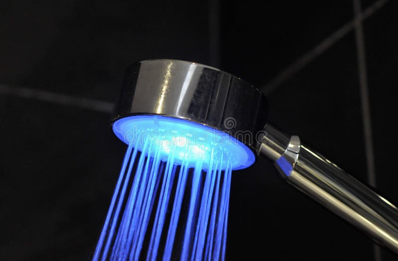 Blue Coloured Shower Head on Black Tile Background Stock Photo Image