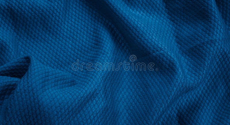 Blue cotton fabric with an interesting pattern royalty free stock images