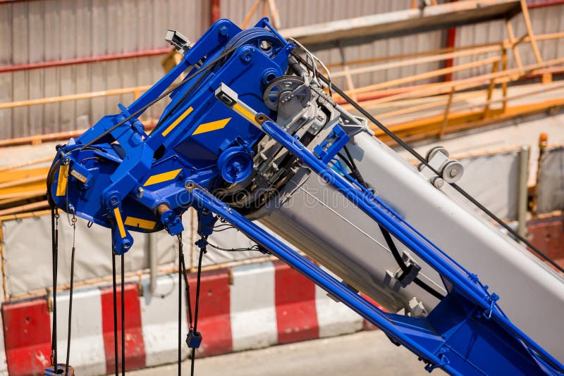 Blue Crane Boom with Hooks and Sling Cable at Construction Site Stock