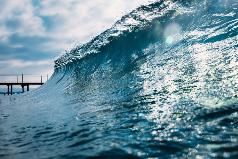 Blue Crystal Wave in Ocean. Breaking Wave and Sun Light Stock Image