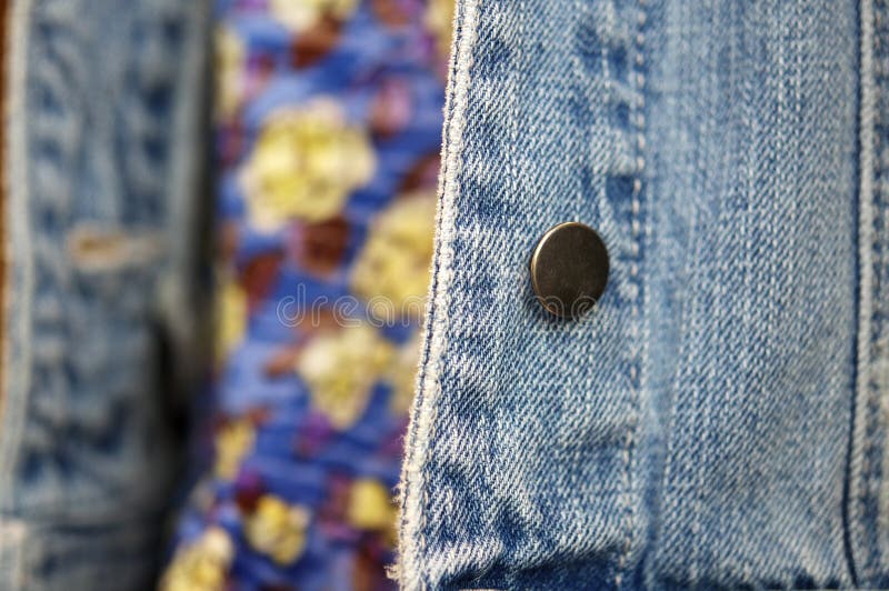 Blue denim material on jacket stock photo