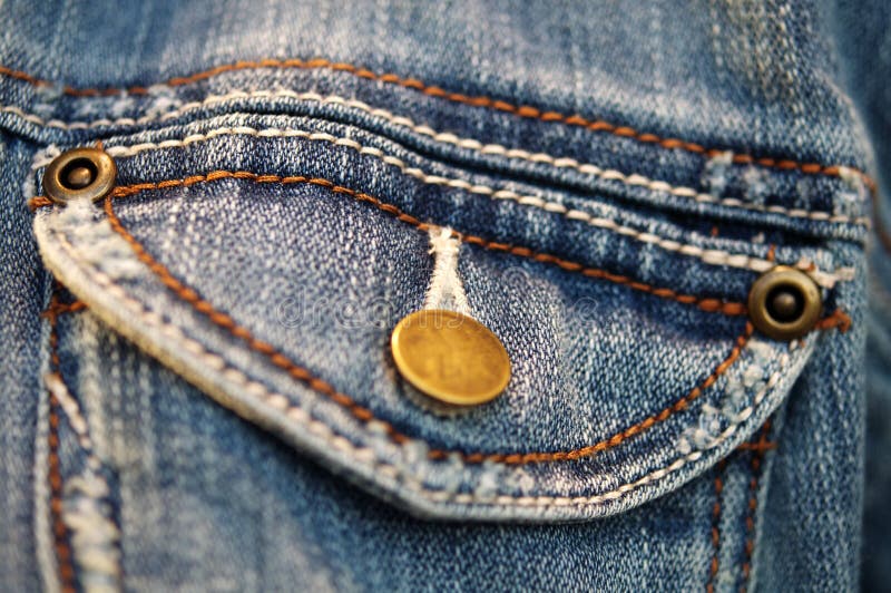Blue denim material on jacket royalty free stock photo