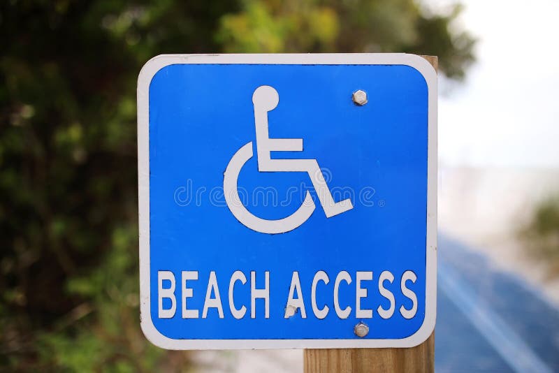 Blue Disabled Beach Access Sign at Public Ocean Access Path royalty free stock photography