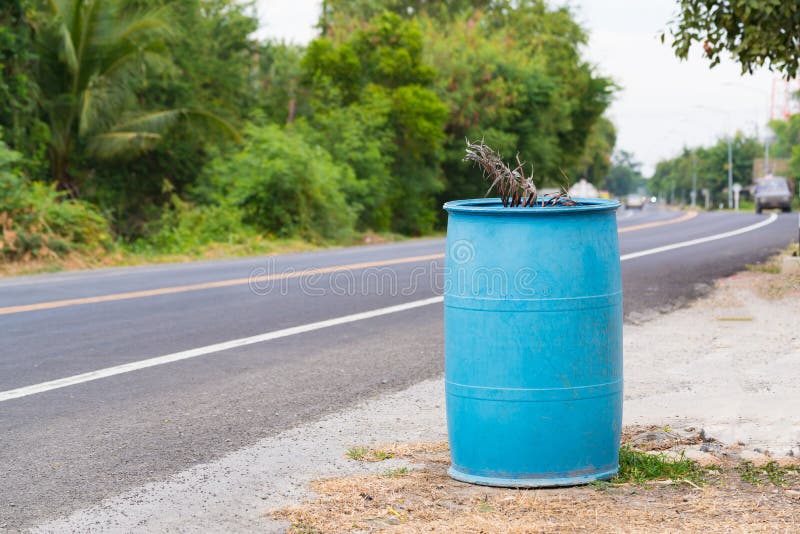 Blue dustbin or trashcan royalty free stock photo