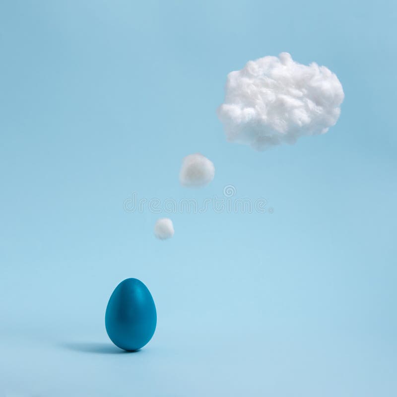 Blue Easter egg is thinking on pastel blue background. Comic book motive. Minimalistic concept stock photography