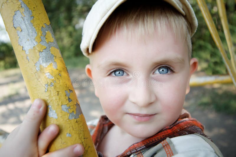 Blue-eyed boy in the park