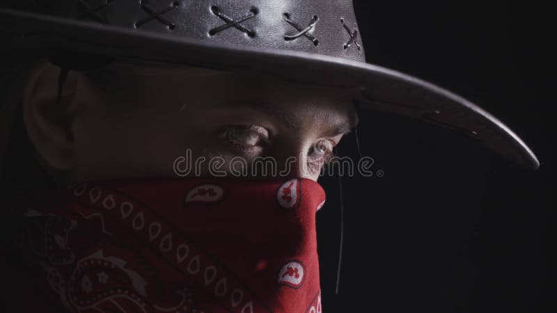 Young cowgirl with red bandana on her face with a hat, 4k