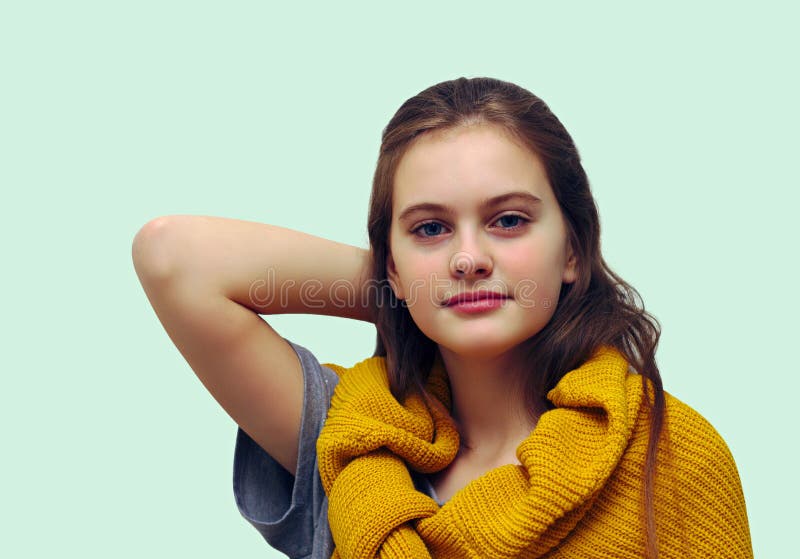 blue eyed shy girl with flowing hair. Studio model shot