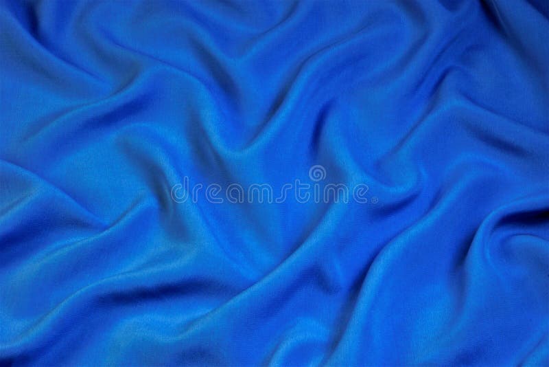 Blue fabric abstract background for design and creativity. Folds of fabric form a natural unique creative, abstract pattern stock photo