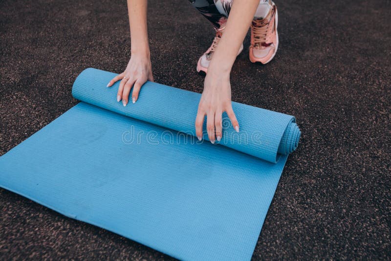 Blue fitness Mat after training at the stadium royalty free stock photos Blue fitness Mat after training at the stadium royalty free stock photos
