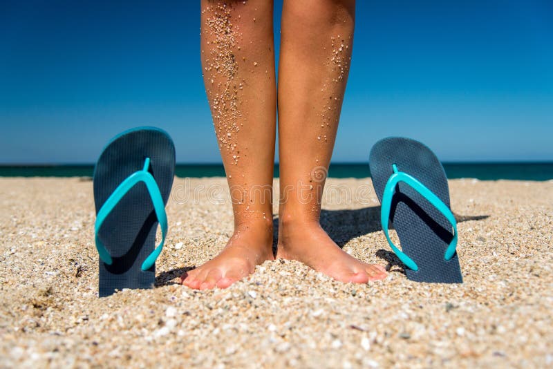 Blue Flip-flops and Human Legs on the Sand - a Concept for Summer ...