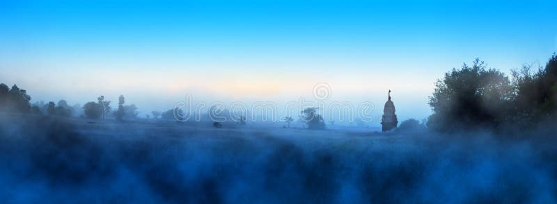 A blue foggy morning on grassland stock images A blue foggy morning on grassland stock images