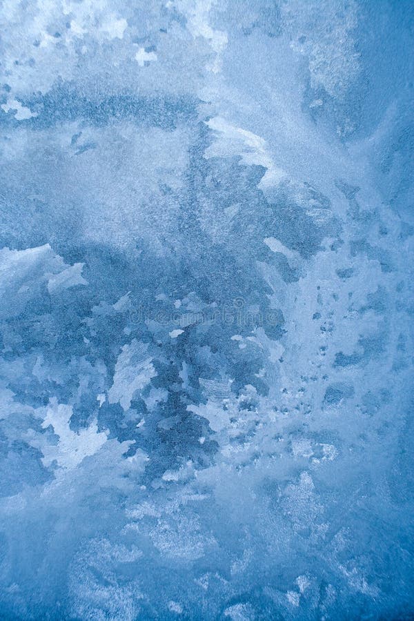 Blue Frozen Glass Pane with Winter Florid Pattern. Stock Photo - Image ...