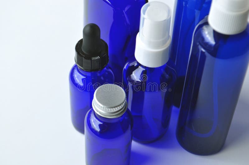 Blue glass bottles for cosmetic lotions, serums, oils