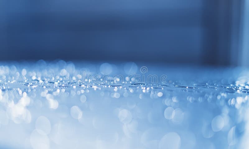 Blue glass with raindrops background texture horizontal top view isolated, rain on the window backdrop, abstract light bokeh