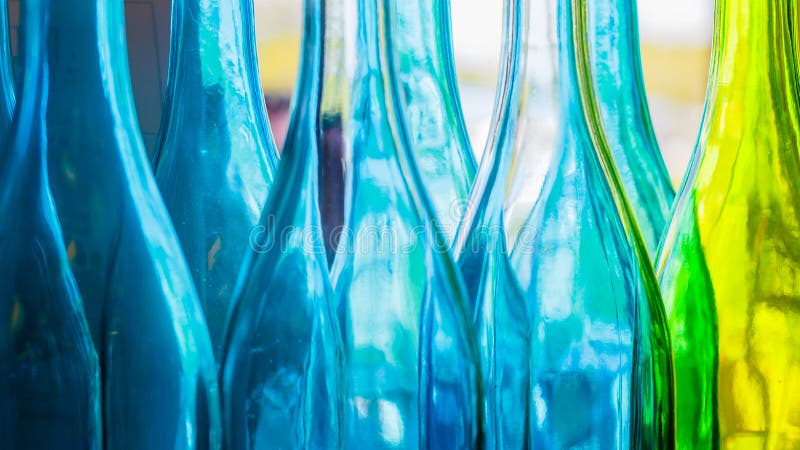 Blue and green colorful bottles stock photos