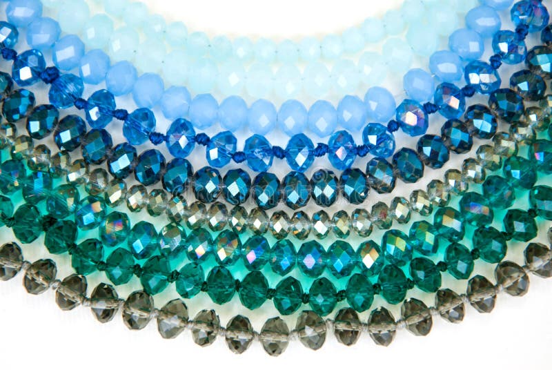 Blue Green Colorful Shinny Crystal Beads Glass Isoalted on White Background Copy space Hobby Handmade Fashion Beauty