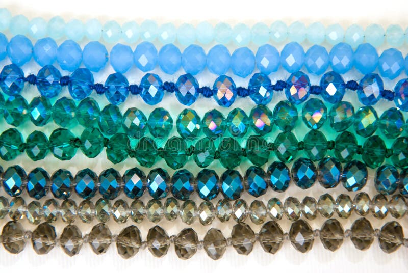 Blue Green Colorful Shinny Crystal Beads Glass Isoalted on White Background Copy space Hobby Handmade Fashion Beauty