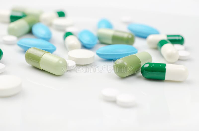 Blue and green pills stock photo