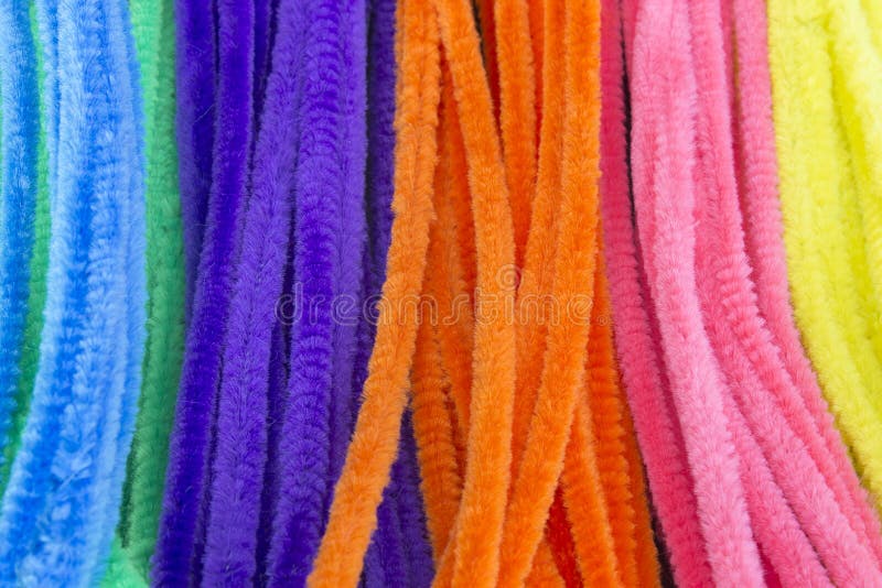 Blue,Green,Purple,Orange,Pink and Yellow Pipe Cleaners Background