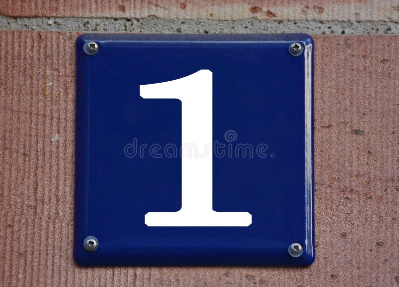 A Blue House Number Plaque on a Red Wall, Showing the Number One Stock