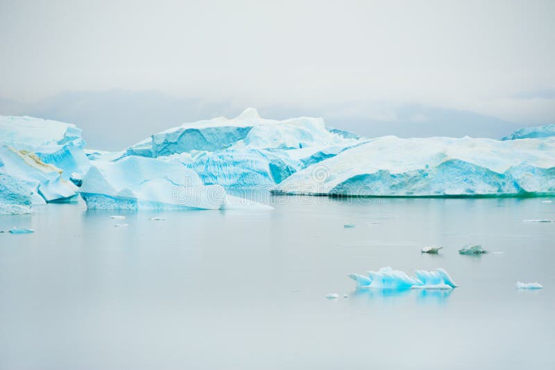 Blue Icebergs on the Shore of Atlantic Ocean in Greenland Stock Image - Image of landscape