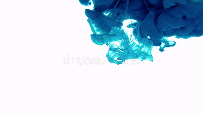 Blue ink in water. Creative slow motion. On a white background.