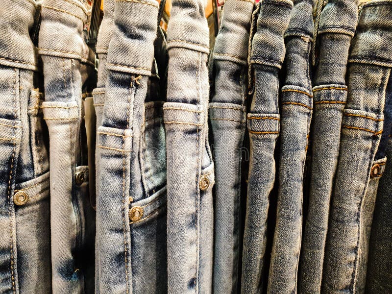 Blue Jeans Denim Clothing Hanged on the Rack Stock Image - Image of ...