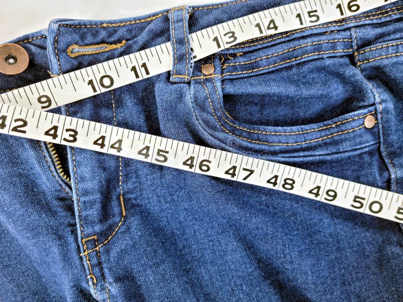 Blue Jeans with Tape Measure Stock Image - Image of fitness, isolated ...