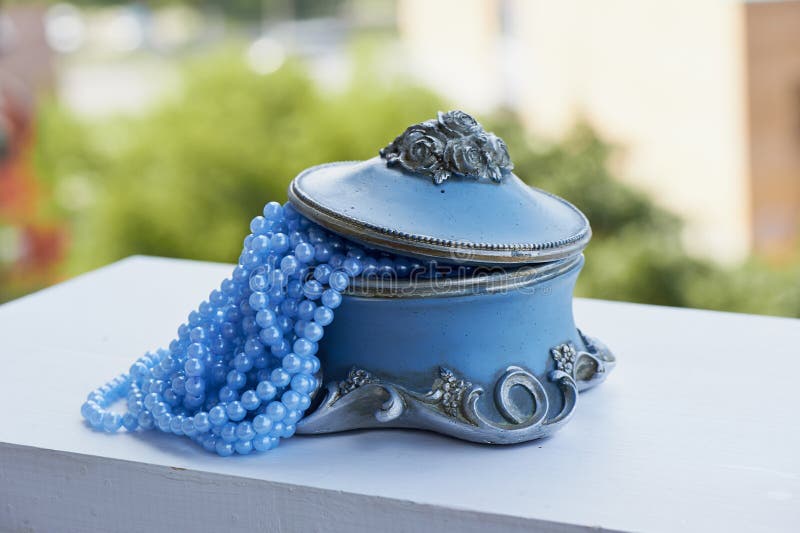 Blue Jewelry Box with the Silver Moldings on the Legs, Beads a String
