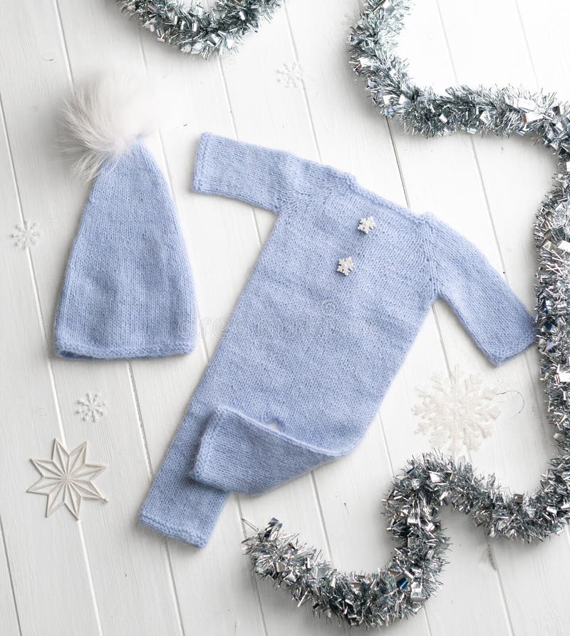 Blue Knitted Baby Clothes with White Knitting Yarns Stock Photo Image