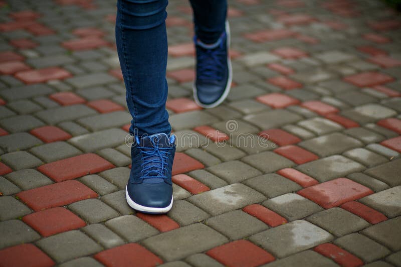 Blue Leather Sneakers with a White Sole and Blue Laces on the Legs ...