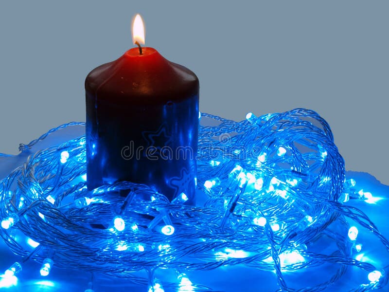 Blue LED and the candle stock photo. Image of celebration 12091554