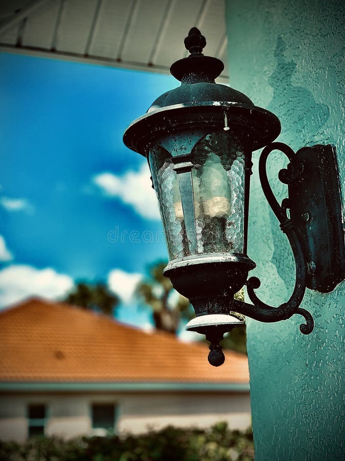Blue Light Attached To Outside of Florida House Wall Stock Image