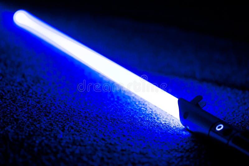 Blue light Sword Saber Laying on Carpet Floor