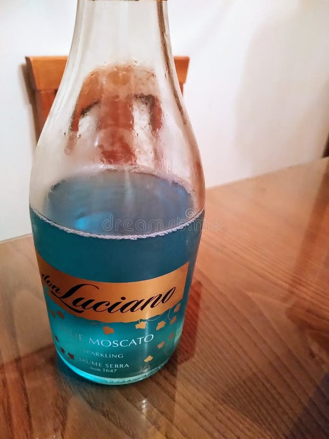 Blue Liquor Bottle To Celebrate. Editorial Image Image of exotic