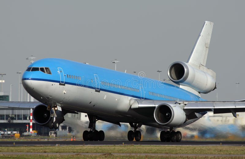 A blue MD11 takes of at Schiphol Airport. A blue MD11 takes of at Schiphol Airport