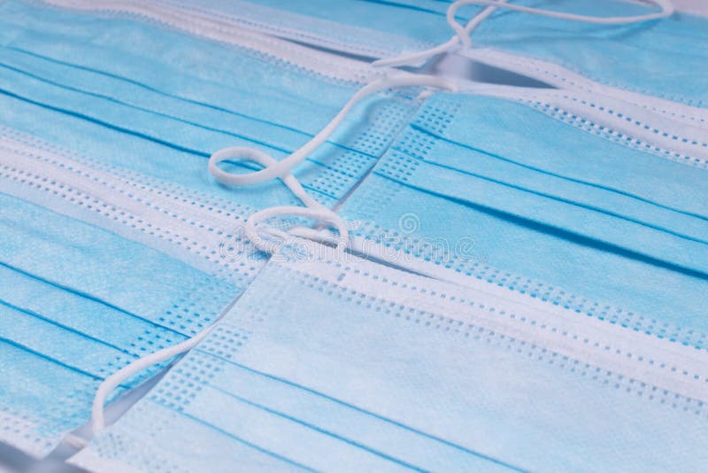 Blue Medical Masks Stacked Next To Each Other Stock Photo Image of
