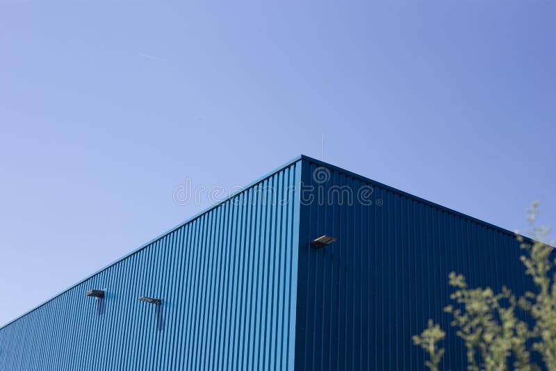 Blue Metal Building on Sky Background Stock Image - Image of wall