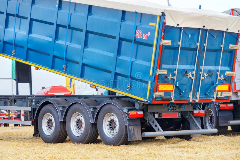 Blue metal semitrailer grain truck for transporting bulk materials