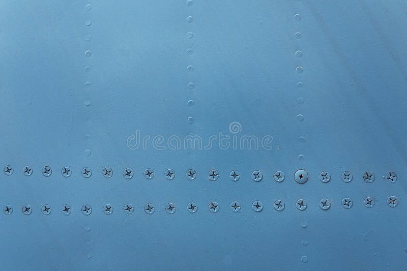 Blue metal wall background texture with a rivets royalty free stock image Blue metal wall background texture with a rivets royalty free stock image