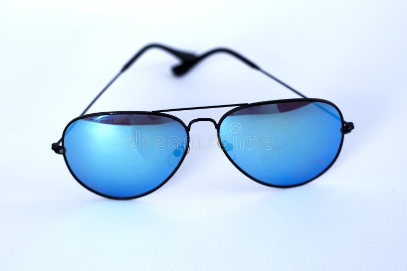 Blue mirrored sunglasses with anti-reflective coating and UV protection on a white background. royalty free stock photos Blue mirrored sunglasses with anti-reflective coating and UV protection on a white background. royalty free stock photos