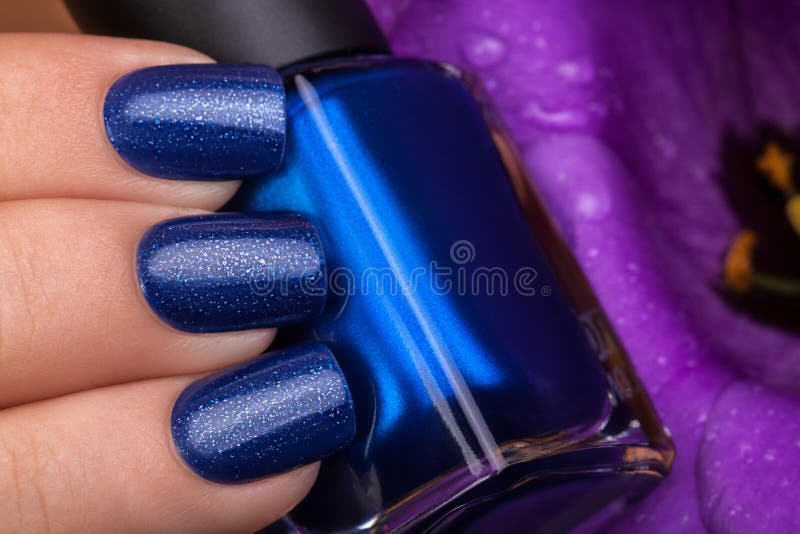Blue nail polish. stock photo. Image of hand, manicured 63230206