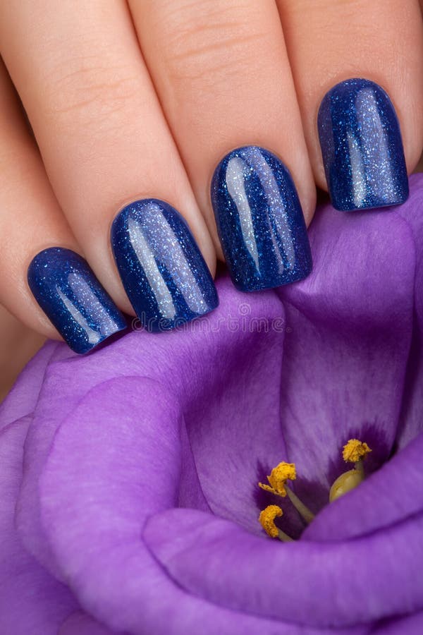 Blue nail polish. stock photo. Image of beauty, hands 63230196