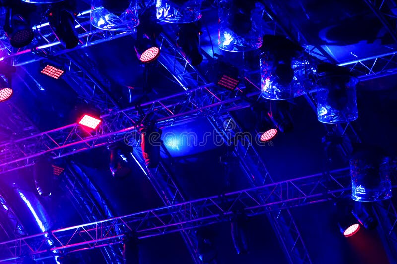 Blue Neon Light. Rays of Light from Concert Lighting on a Dark