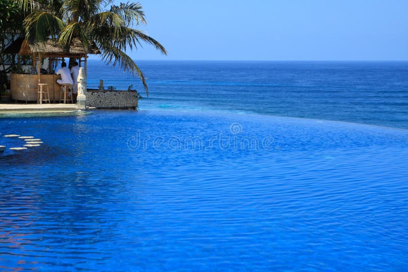 Blue Ocean With Swimming Pool of Luxury Hotel stock images