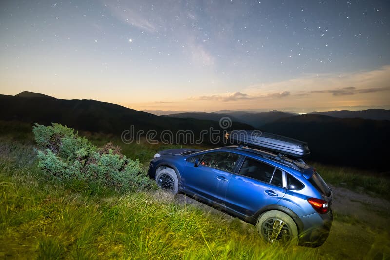 Blue Offroad SUV Car with Roof Trunk on Background of Very Beautiful Night  Starry Sky after Sunset. Freedom and Travel Stock Photo - Image of tourism,  astro: 259061662