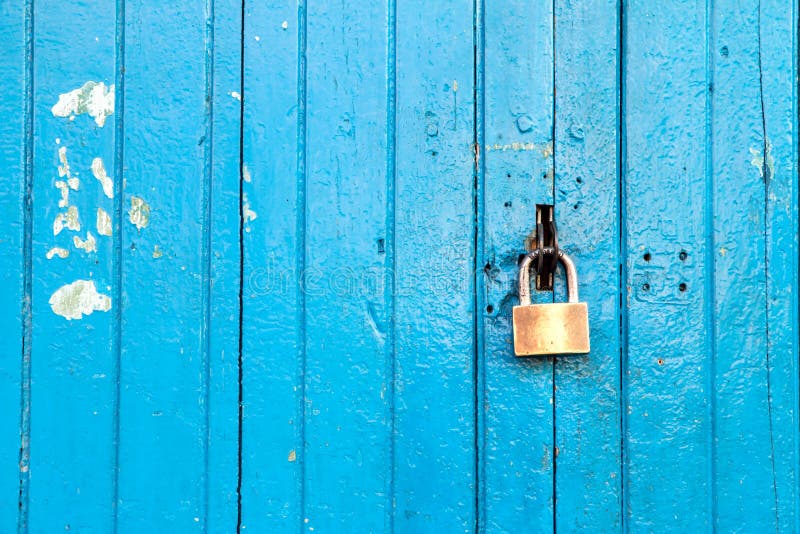 Blue old wood door with the lock